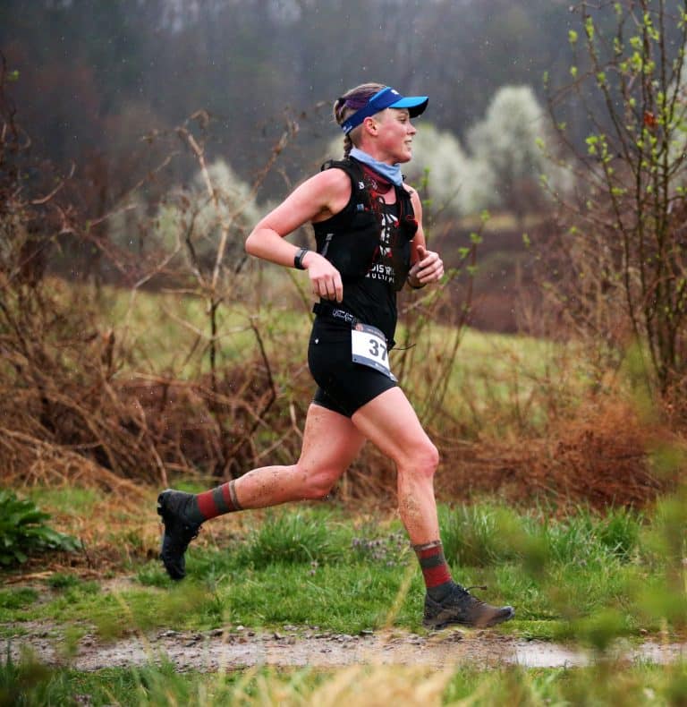 M. running on a trail during a race