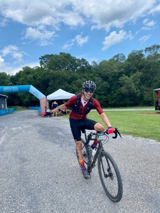 John riding his gravel bike at a race