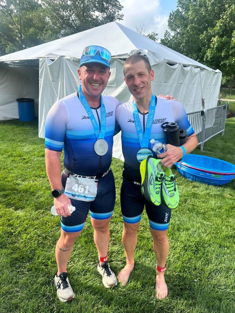 Two Multisport Mastery athletes with their Naperville Sprint Triathlon medals