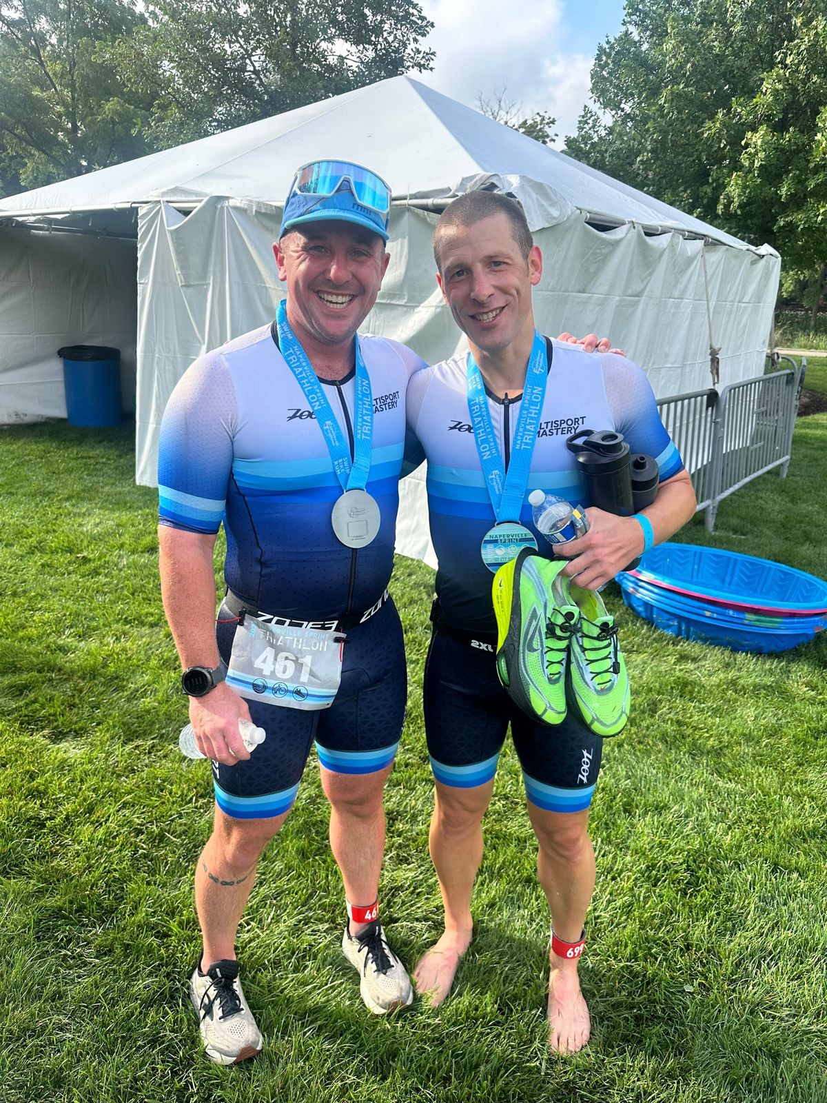 Two Multisport Mastery athletes with their Naperville Sprint Triathlon medals