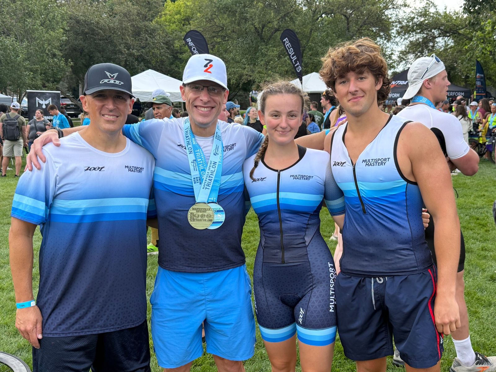 Four Multisport Mastery athletes together after the Naperville Sprint Triathlon